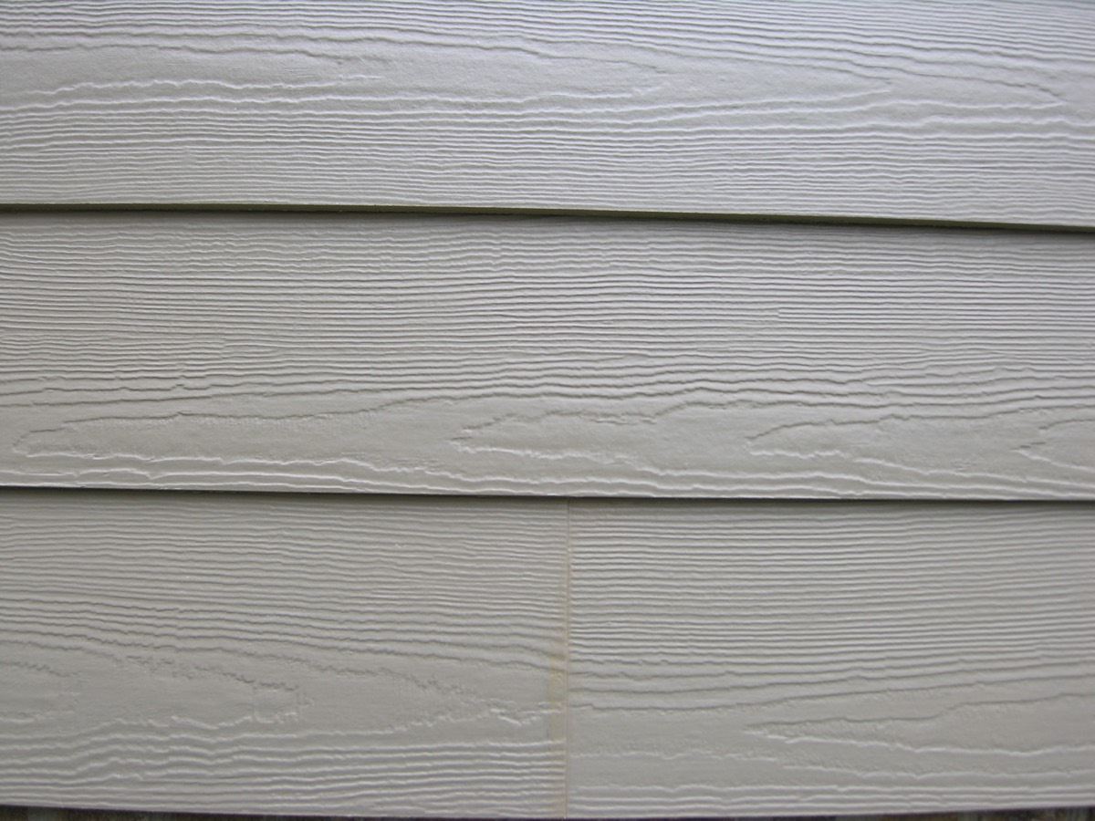 Close-up of James Hardie fiber cement siding wood grain texture